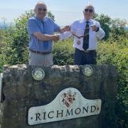Outgoing Richmond Rotary president Jos Huddleston, left, and incoming president David Stewart