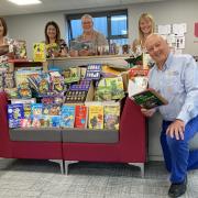 Peter Phillips with staff from Darlington Building Society who have donated children's books