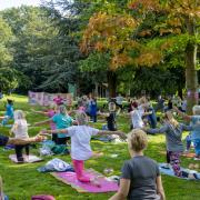 Yoga practitioners gathered in the grounds of Walworth Castle to raise money for Cancer Research UK