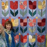 Petra Lloyd, Debbie Walker and Frances Connolly with the quilt