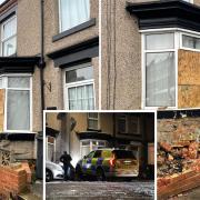 Pictures show the damage left to a Darlington home after a police car crashed through the garden wall and into the front of the house.