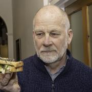 Phil Hall with his locust sandwich. Picture: Chris Barron