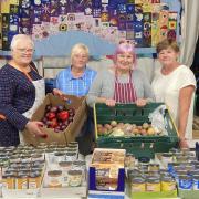 Colburn Hub volunteers with some of the donated food/produce