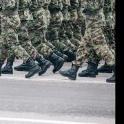 Soldiers in camouflage marching in formation