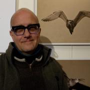 Paco Valera in front of his work at the ’Cry of the Curlew’ exhibition
