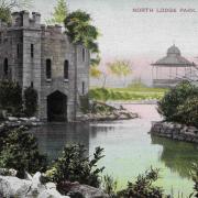 An Edwardian postcard of North Lodge Park showing the pond and the boathouse, which dated from the 1820s, and the bandstand which was new addition when the park opened in 1903