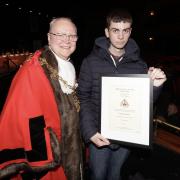 Elliot Gordon gets his award from Cllr Jim Beall