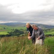 WILDFLOWER: Tanya St. Pierre (left) and Margaret Barker, secretary of St Oswald’s Parochial Church Council in Horton-in-Ribblesdale, who will be creating a mini wildflower meadow in the churchyard four miles away