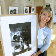 DISPLAY: Rural Arts manager Angela Holt with one of the images by Ampleforth photographer Lucy Saggers on show at the gallery in Thirsk Picture: Richard Doughty