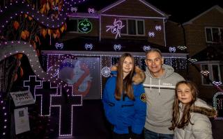 Incredible light show at The Stonebanks house in Hunwick pictured Megan 14 dad Brad and Molly 10 Picture: SARAH CALDECOTT