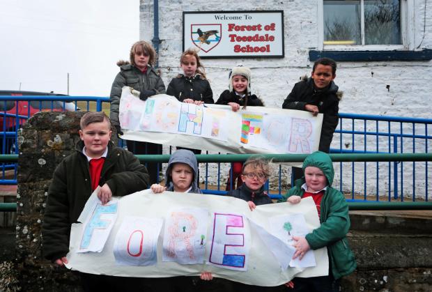 Darlington and Stockton Times: Children campaign for the school to be saved back in 2016. Picture: NORTHERN ECHO