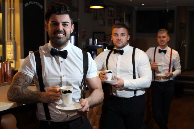 Darlington and Stockton Times: Big Brother star Anthony Hutton is adding the sale of  coffee to his bar/barber shop business in the centre of Darlington. He is pictured (front) with his head barber Ryan Watson (centre) and bar manager Junior Levi Mortimer (right). Picture: CHRIS BOOTH